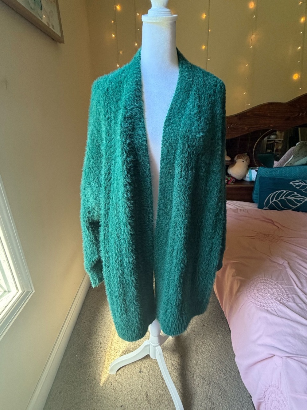 This beautiful deep emerald green/teal open-front cardigan from Lane Bryant